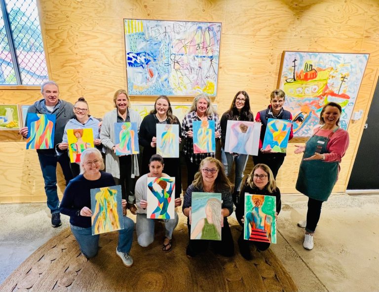 Participants painting together at an ImmersionArts workshop